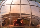 Reverse panoramic image of Yaquina Head from the copper reflector... and my hands.